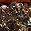 Large orchestra performing on stage 