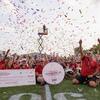 Photo of band members celebrating announcement of 2025 Macy's Thanksgiving Day parade